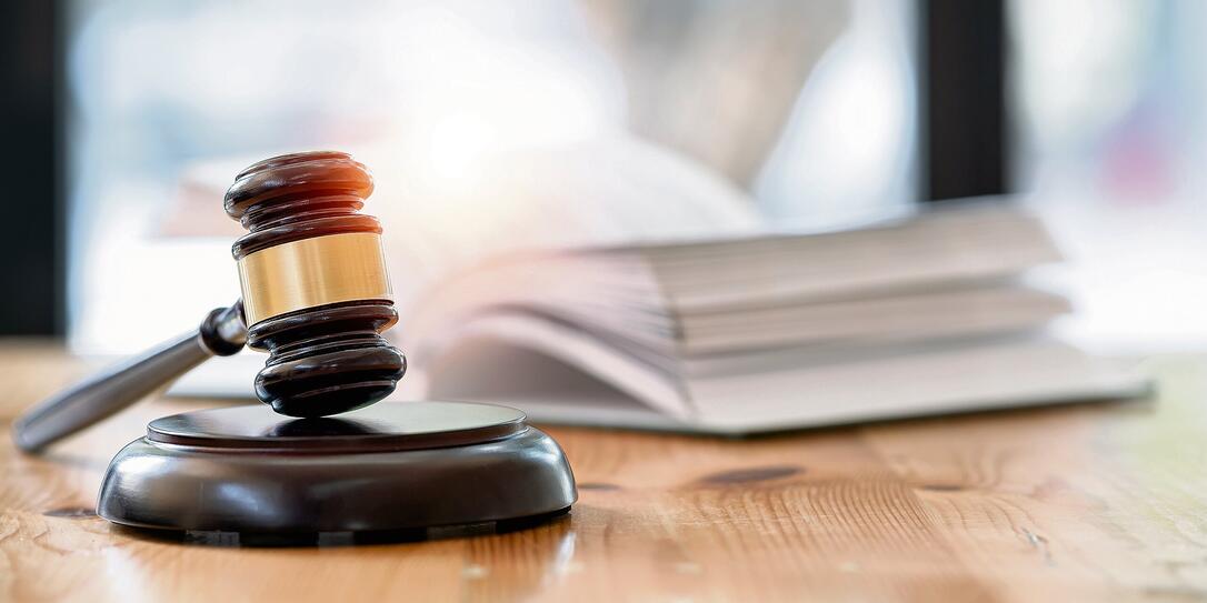 Wooden brown judge gavel on the table, copy space, banner background. Wooden brown judge gavel on the table, copy space, banner background.