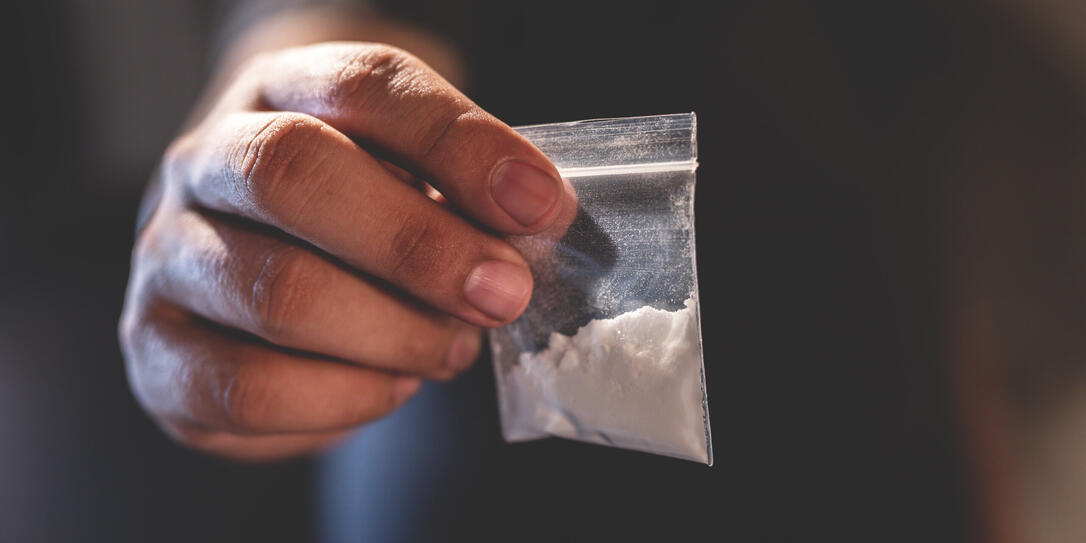 Junkie is using drugs using heroin in the room.