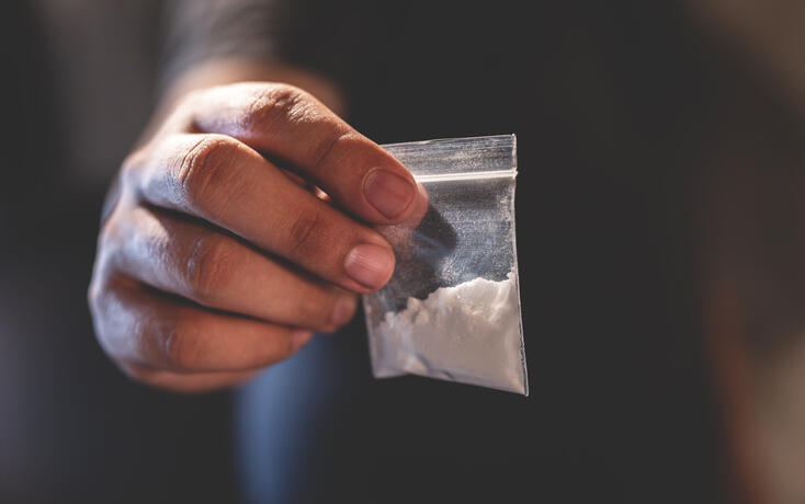 Junkie is using drugs using heroin in the room.