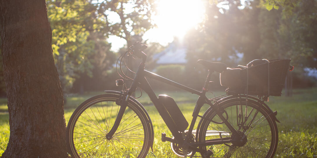 electric bicycle silhouette on a bright sunny day electric bicycle silhouette on a bright sunny day