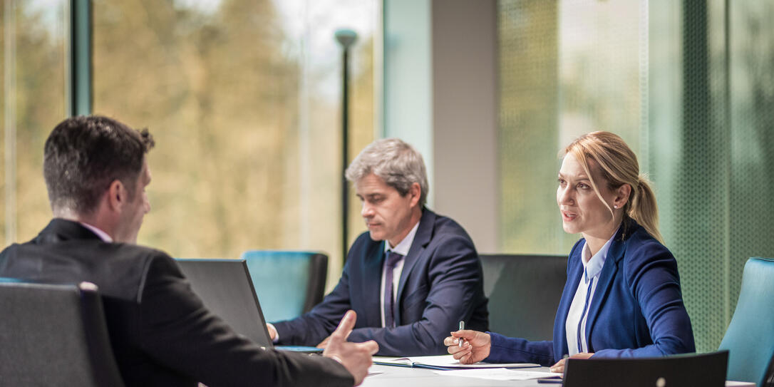 Business people working in board room