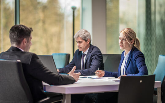 Business people working in board room