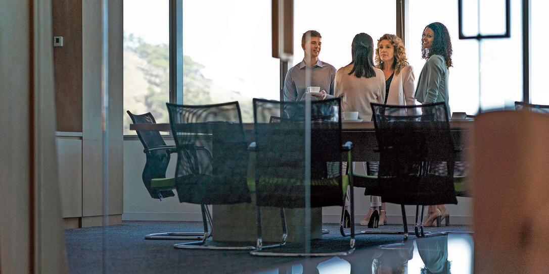 Business people in meeting seen through glass