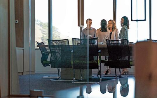 Business people in meeting seen through glass