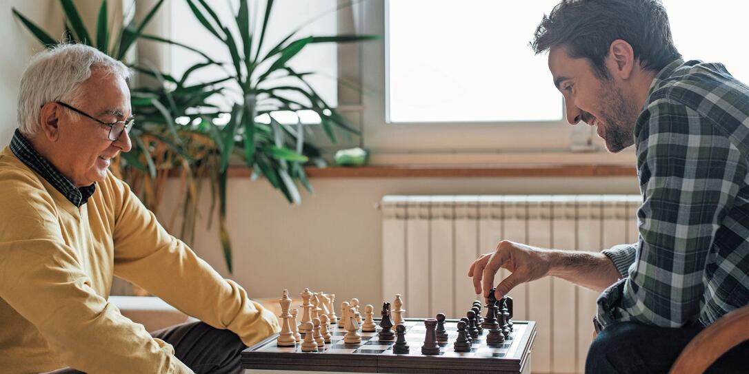 Happy men playing chess Happy men playing chess