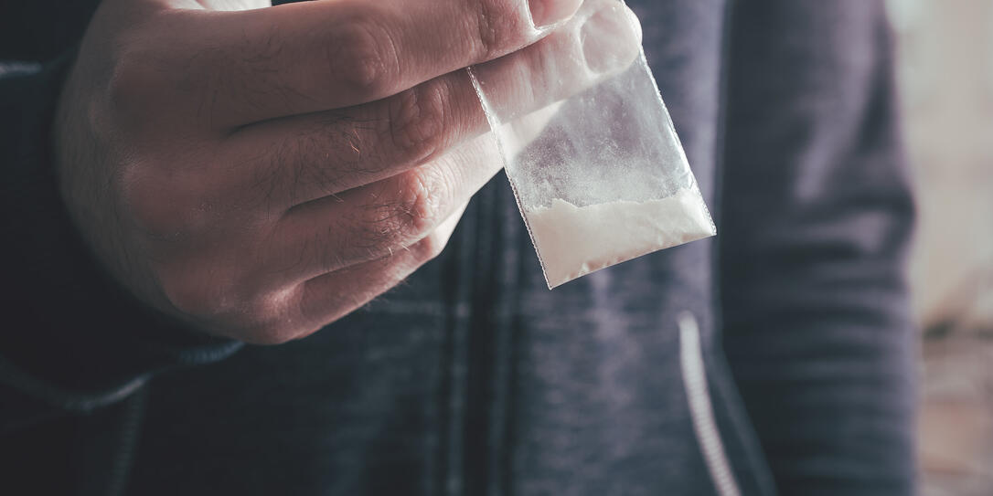 Dealing Drugs By A Man Holding A Little Bag With White Powder In His Hand Dealing Drugs By A Man Holding A Little Bag With White Powder In His Hand