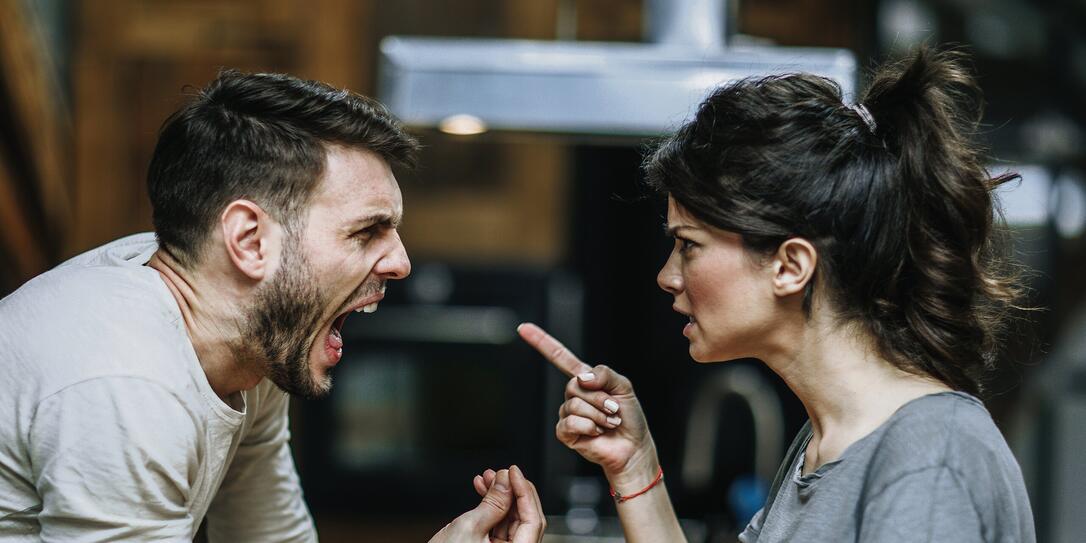 Furious couple arguing while having problems in their relationship.