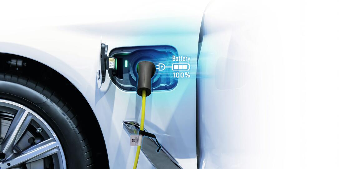 Power cable pump plug in charging power to electric vehicle EV car.