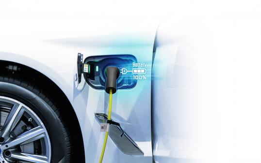 Power cable pump plug in charging power to electric vehicle EV car.