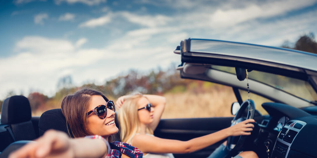 Friends traveling with car
