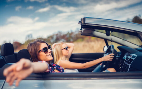 Friends traveling with car