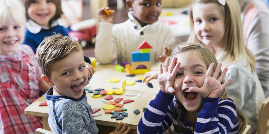 Playful preschoolers having fun making faces