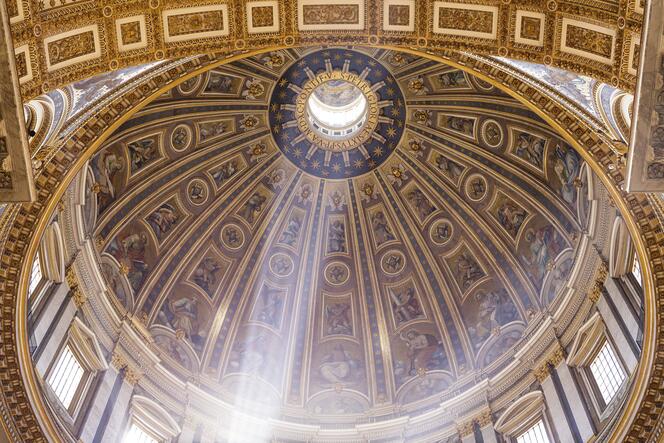 Rays of light in St. Peter's Dome in Rome