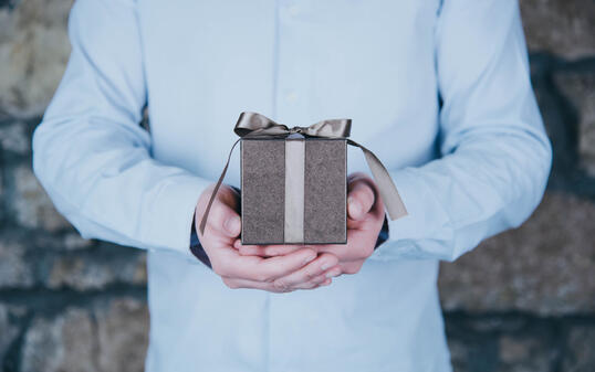 Male hands holding a gift