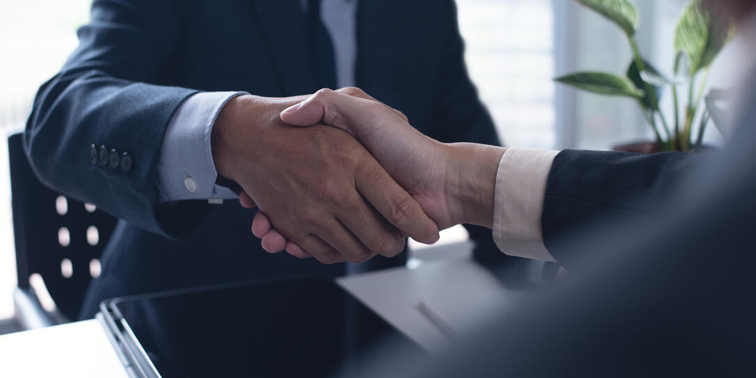 Business deal. Two businessmen shaking hand after signing business contract at office, congratulation, investor, success,  business interview, partnership, teamwork  concept